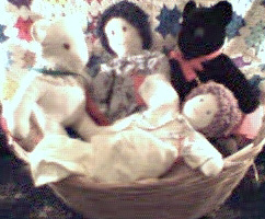 Dolls and teddy bears in a basket