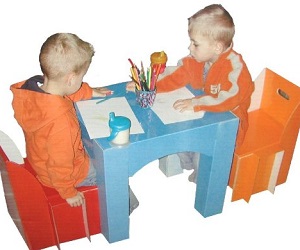 Image: Children's Table and Chair Set -  Set up and put away these lightweight coated cardboard pieces in just minutes