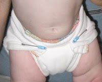 Image: Chinese Prefold diaper fastened with plastic head diaper pins