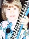 Image: Joshua at 4 years, showing off his Christmas gifts