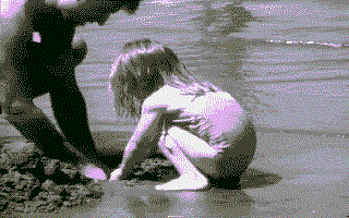 Image: child and parent playing on the beach