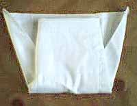 Image: Fasten Velcro(r) or snaps of diaper cover at baby's sides
